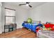 Cozy bedroom featuring wood floors and ample natural light at 1384 E Leslie Ave, San Tan Valley, AZ 85140