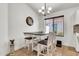 Charming dining area featuring a chandelier and a cozy dining set with seating for four at 1384 E Leslie Ave, San Tan Valley, AZ 85140