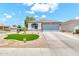 Charming single story home with desert landscaping and a well manicured artificial lawn at 1384 E Leslie Ave, San Tan Valley, AZ 85140