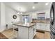 The kitchen features an island with bar seating and an adjacent dining area at 1384 E Leslie Ave, San Tan Valley, AZ 85140