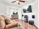 Entertainment room featuring a comfortable couch, wooden floors and a modern entertainment system at 1384 E Leslie Ave, San Tan Valley, AZ 85140