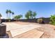 Large backyard with custom pavers, desert landscaping, and block wall at 13862 W Fargo Dr, Surprise, AZ 85374