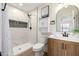 Modern bathroom featuring a tiled shower, a vessel sink, and stylish fixtures at 13862 W Fargo Dr, Surprise, AZ 85374