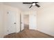 Bedroom showcasing hard flooring, closet and ceiling fan at 13862 W Fargo Dr, Surprise, AZ 85374