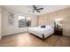 Serene bedroom features a comfortable bed, a ceiling fan, and neutral decor at 13862 W Fargo Dr, Surprise, AZ 85374
