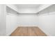 Walk-in closet with rods for hanging clothes at 13862 W Fargo Dr, Surprise, AZ 85374