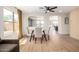 Bright dining area with a glass-top table, comfortable chairs, and large windows at 13862 W Fargo Dr, Surprise, AZ 85374