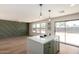 Open-concept living area features modern design, large windows and kitchen island with quartz countertop at 13862 W Fargo Dr, Surprise, AZ 85374