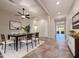 Bright dining room with a ceiling fan, decorative rug, and an open layout at 14572 W Medlock Dr, Litchfield Park, AZ 85340