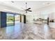Open-concept living space with seamless access to the outdoor patio and pool area at 14572 W Medlock Dr, Litchfield Park, AZ 85340