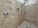 Tiled shower with built-in bench and niche at 14572 W Medlock Dr, Litchfield Park, AZ 85340