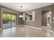 Dining room with sliding glass doors leading to the backyard and a pass-through to the kitchen at 15928 W Zinnia Ct, Surprise, AZ 85374