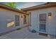 Front entrance featuring concrete walkway, desert landscaping, and dual entrances at 15928 W Zinnia Ct, Surprise, AZ 85374