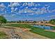 Beautiful golf course with water feature and desert landscaping, showcasing scenic community views at 15928 W Zinnia Ct, Surprise, AZ 85374
