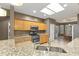 Bright kitchen featuring granite countertops, a gas range, stainless steel appliances, and ample cabinet space at 15928 W Zinnia Ct, Surprise, AZ 85374