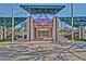 Del E. Webb Memorial Field park entrance featuring a covered walkway and well manicured landscaping at 15928 W Zinnia Ct, Surprise, AZ 85374