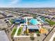 Aerial view showcasing community amenities: pool, playground, and picnic areas at 16004 W Honeysuckle Dr, Surprise, AZ 85387