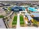 Aerial view of the community amenities including pool, playground, and picnic area at 16004 W Honeysuckle Dr, Surprise, AZ 85387