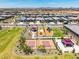 An aerial view of a playground, splashpad, and pickleball court with picnic tables in a Gathering friendly community at 16004 W Honeysuckle Dr, Surprise, AZ 85387