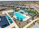 Aerial view of the community pool and playground, showcasing the recreational amenities at 16004 W Honeysuckle Dr, Surprise, AZ 85387