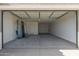 Open garage ready for parking and storage with visible mechanics at 16004 W Honeysuckle Dr, Surprise, AZ 85387