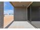 Covered patio featuring a large sliding glass door and outdoor space at 16004 W Honeysuckle Dr, Surprise, AZ 85387
