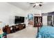 A light filled bedroom is furnished with modern furniture, adjacent to a spa-like bathroom at 16210 W Durango St, Goodyear, AZ 85338