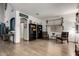 Bright living area with wood floors, arched doorways, and cozy seating at 16210 W Durango St, Goodyear, AZ 85338