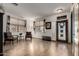 Open living area with natural light, wood floors, and comfortable seating near the front door at 16210 W Durango St, Goodyear, AZ 85338