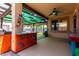 Patio with bar, decorated columns, and overhead covering at 16210 W Durango St, Goodyear, AZ 85338