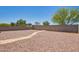 Spacious backyard with rock landscaping and a brick wall at 17345 W Spur Dr, Surprise, AZ 85387