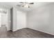 A bedroom with wood-look floors, double door closet and neutral color scheme at 17345 W Spur Dr, Surprise, AZ 85387