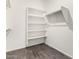 A walk-in closet with built-in shelving and a hanging rod at 17345 W Spur Dr, Surprise, AZ 85387