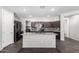 Stylish kitchen featuring granite countertops, stainless steel appliances, and ample cabinet space at 17345 W Spur Dr, Surprise, AZ 85387