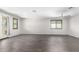 Bright and spacious living room with natural light, wood-style flooring, and access to the outdoor area at 17345 W Spur Dr, Surprise, AZ 85387