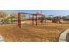 Community playground area featuring swings, climbing, and picnic area at 17345 W Spur Dr, Surprise, AZ 85387