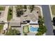 Stunning aerial view of home featuring a pool, putting green, mature landscaping, and charming architectural details at 1750 E Mallory St, Mesa, AZ 85203