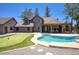 Beautiful backyard featuring a refreshing pool and a fun putting green at 1750 E Mallory St, Mesa, AZ 85203