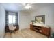 Comfortable bedroom with natural light, hardwood floors, and ample closet space at 1750 E Mallory St, Mesa, AZ 85203