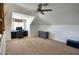 Upstairs bonus room featuring a desk, office chair and a blue storage drawer at 1750 E Mallory St, Mesa, AZ 85203