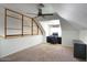 Angled attic-style bonus room featuring a desk, office chair and storage drawer at 1750 E Mallory St, Mesa, AZ 85203