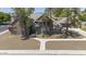 Beautiful single-Gathering home with mature landscaping showcasing the home's architectural design and curb appeal at 1750 E Mallory St, Mesa, AZ 85203