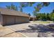 Side view of home showing detached garage, backyard pool and putting green at 1750 E Mallory St, Mesa, AZ 85203