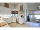 Stylish kitchen with white cabinetry, quartz countertops, and modern appliances for gourmet cooking at 1750 E Mallory St, Mesa, AZ 85203