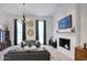 Bright living room featuring a decorative fireplace, chandelier, and comfortable seating arrangement at 1750 E Mallory St, Mesa, AZ 85203