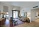 Open living room area with wood floors, comfortable seating and access to the backyard at 1750 E Mallory St, Mesa, AZ 85203