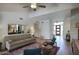 Open-concept living room featuring wood floors, neutral furniture and views of the entry foyer at 1750 E Mallory St, Mesa, AZ 85203