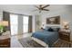 Relaxing bedroom featuring light-filled windows, cozy decor, and hardwood floors at 1750 E Mallory St, Mesa, AZ 85203