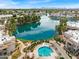 Stunning aerial view showcasing the community pool and lake surrounded by lush landscaping at 1825 W Ray Rd # 1119, Chandler, AZ 85224