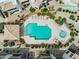 Aerial view of community pool and hot tub area with lounge chairs, landscaping and tile roofed cabana at 1825 W Ray Rd # 1119, Chandler, AZ 85224